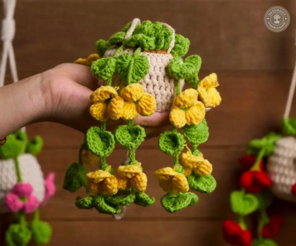Handcrafted Crochet Hanging Flower Pot with Yellow Blooms and Green Foliage