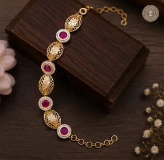 Traditional Gold-Tone Hand Gajra with Magenta Stones