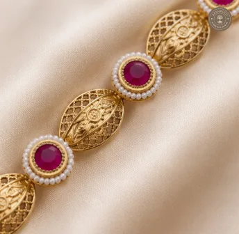 Traditional Gold-Tone Hand Gajra with Magenta Stones